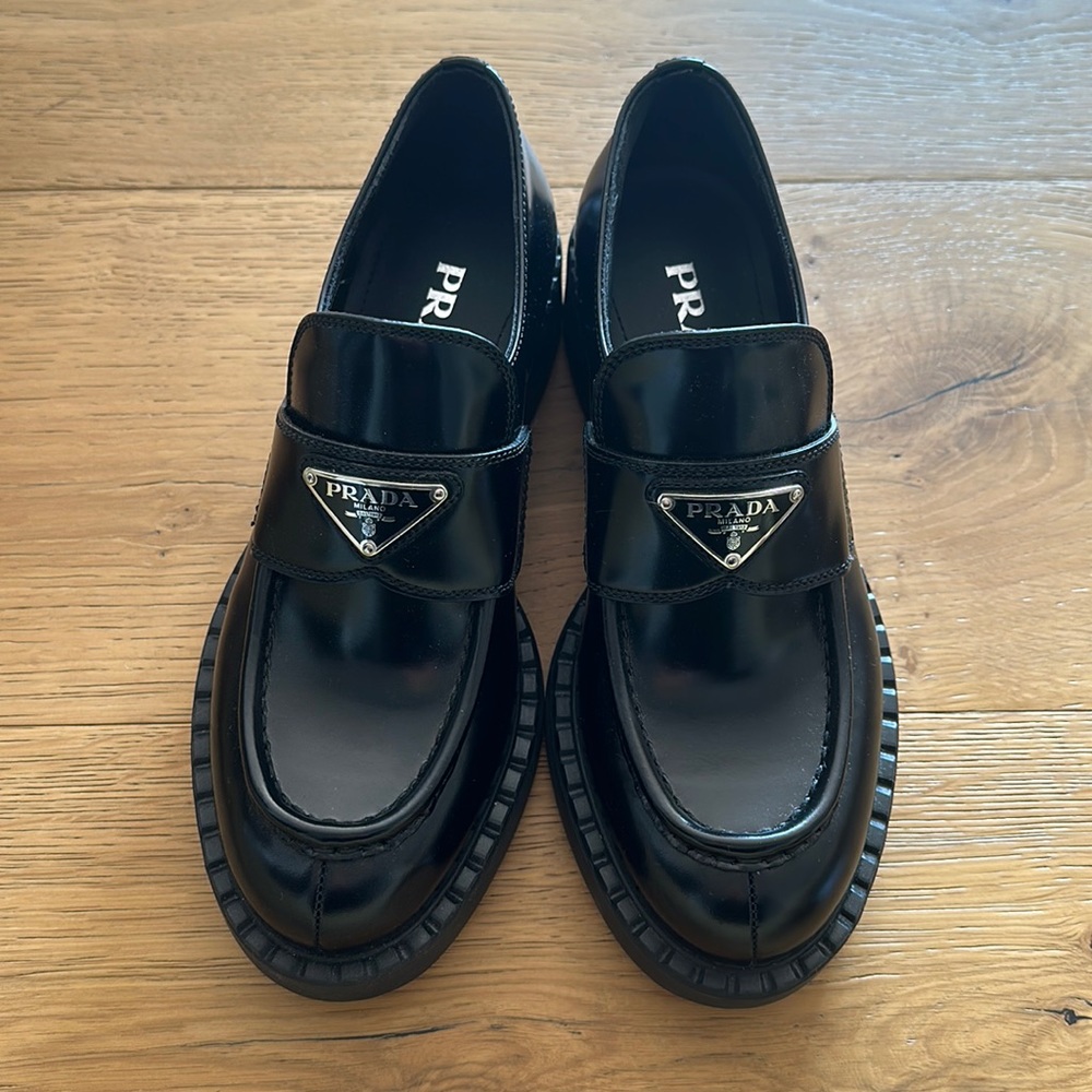 Prada Black Leather Loafers with Silver Triangle Logo